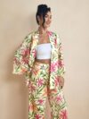 Model wearing the Newness Summer Escape Tropical Print Suit a vibrant and chic outfit perfect for beach vacations and beyond