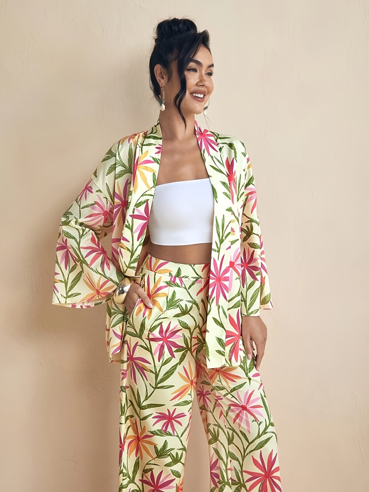 Model wearing the Newness Summer Escape Tropical Print Suit a vibrant and chic outfit perfect for beach vacations and beyond