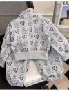 Girl wearing a stylish and windproof Newness Safari Dreams animal print set perfect for outdoor adventures
