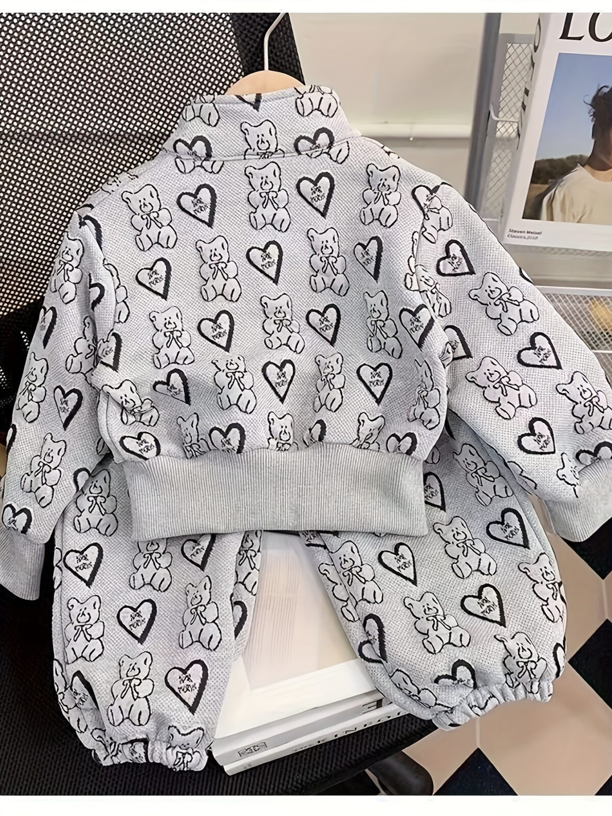 Girl wearing a stylish and windproof Newness Safari Dreams animal print set perfect for outdoor adventures