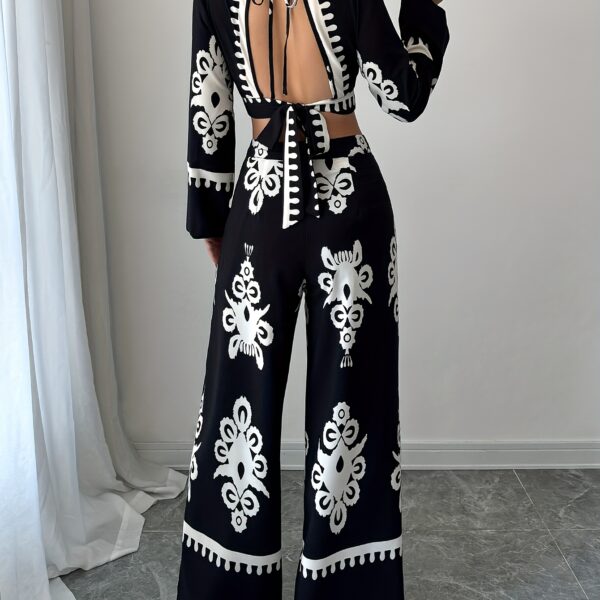 Effortlessly chic Casablanca Ethnic Print Set from Newness featuring a backless top and wide leg pants Model showcases the two piece outfit