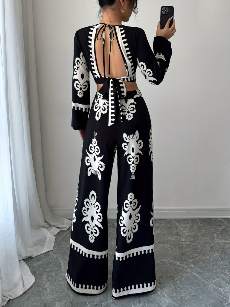 Effortlessly chic Casablanca Ethnic Print Set from Newness, featuring a backless top and wide-leg pants. Model showcases the two-piece outfit.
