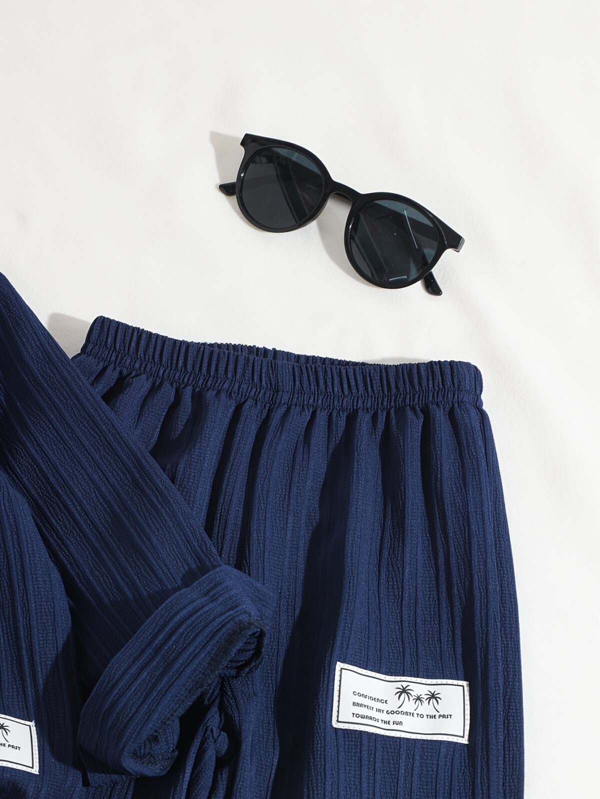 Stylish boys two piece outfit in a trendy striped pattern featuring a comfortable stand collar shirt and cuffed pants perfect for spring or autumn