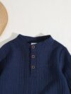 Stylish boys two piece outfit in a trendy striped pattern featuring a comfortable stand collar shirt and cuffed pants perfect for spring or autumn