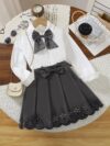 A charming little girl in a classic schoolgirl outfit smiling and playful Newness