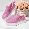 Girls glitter canvas shoes Sparkle Steps in pink showcasing the sparkly glitter fabric and comfortable design Perfect for adding a touch of glam to any outfit