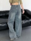 Newness Parisian High Waisted Wide Leg Jeans Flattering comfortable wide leg jeans in a chic style Model wearing light wash denim