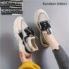 Pair of stylish thick soled womens casual sport shoes in a trendy color shown from the side