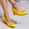 Newness Sunshine Stroll Glossy Yellow Wedge Bow Heels Step into sunshine with these elegant yellow wedge heels featuring a glossy finish and charming bow detail Perfect for adding a touch of summery sophistication to any outfit