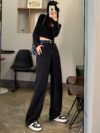 Model wearing Newness Seoul Street Style High Waisted Wide Leg Jeans showcasing the comfortable fit and chic style The jeans are a wide leg style with a high waist
