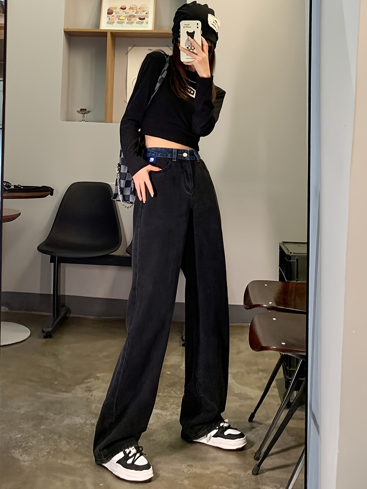 Model wearing Newness Seoul Street Style High Waisted Wide Leg Jeans showcasing the comfortable fit and chic style The jeans are a wide leg style with a high waist