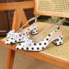 Classic black and white polka dot pumps from Newness perfect for adding a retro touch to any outfit