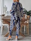 Stylish woman wearing a chic geometric print two piece set perfect for summer and fall The outfit features a flattering silhouette and vibrant print