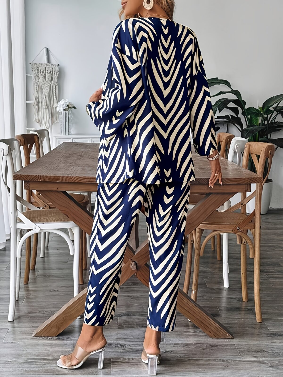Stylish woman wearing a chic geometric print two piece set perfect for summer and fall The outfit features a flattering silhouette and vibrant print