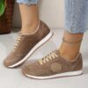 Womens classic flannel low top lace up sneakers with rubber sole shown from the side in a neutral color