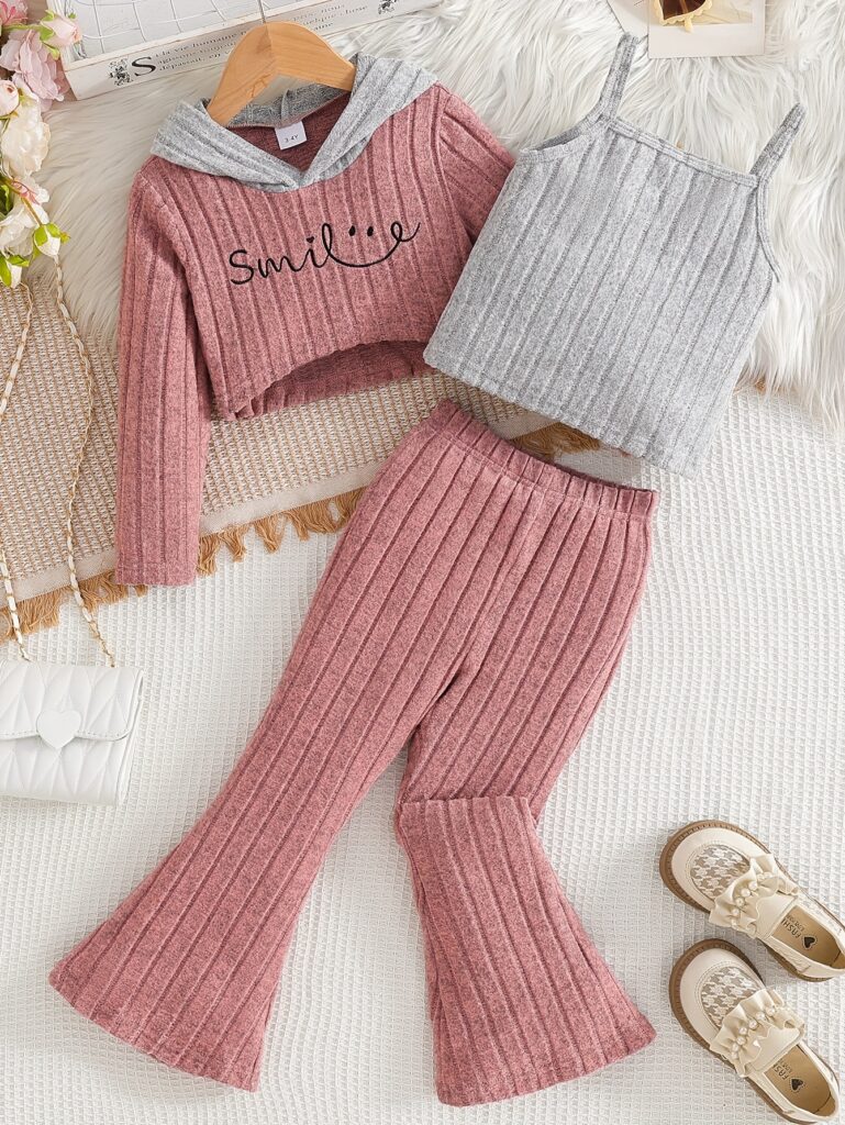 Newness's "Smile" Girls Trendy Set: A stylish three-piece outfit featuring a trendy hoodie, flared pants, and a flattering crop top, perfect for girls who love to express their unique style all year round.