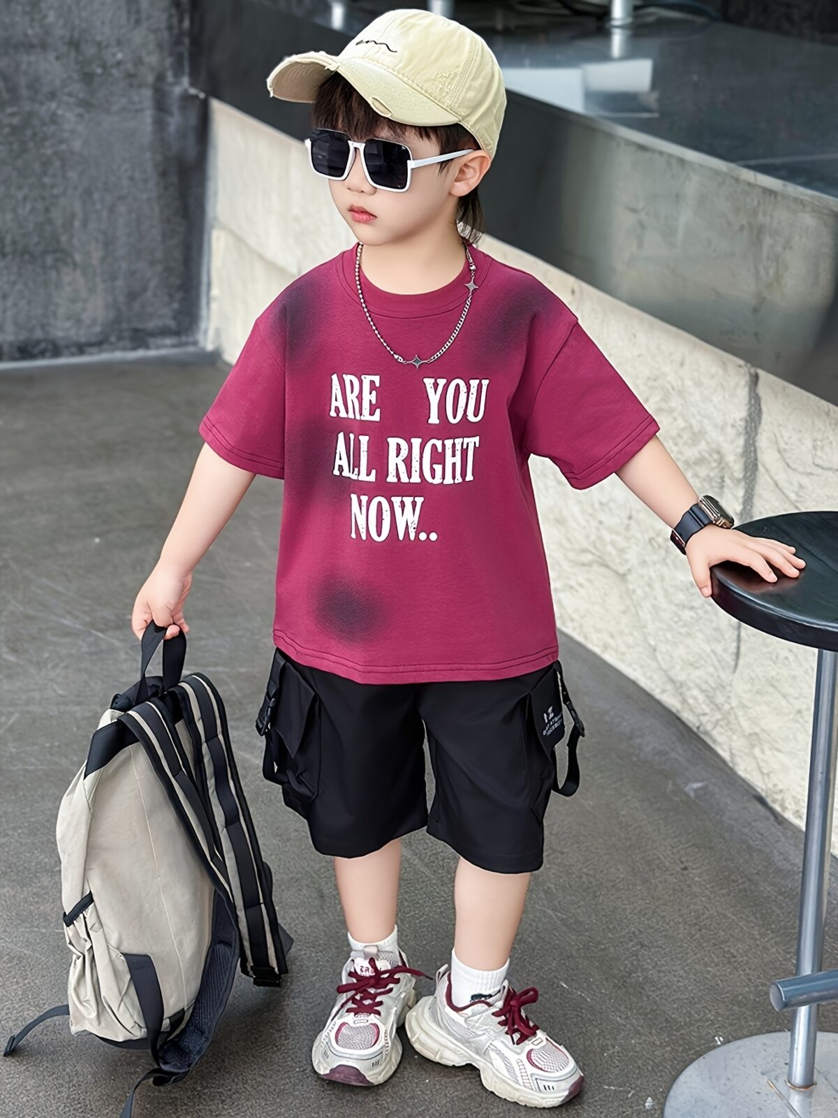 Stylish boys summer outfit alphabet print t shirt and cargo shorts set from Newness Perfect for summer adventures
