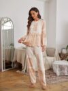 Model wearing a stunning two piece wide leg pants set with a vibrant Dubai Nights print The set is made of luxurious viscose