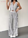 The Newness Riviera Striped Trouser Set in a flattering pose showcasing its relaxed fit and chic style Model is wearing the matching top and trousers