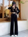 Newness Midnight Hour Black High Waisted Jeans A model showcasing the flattering fit and chic style of the jeans