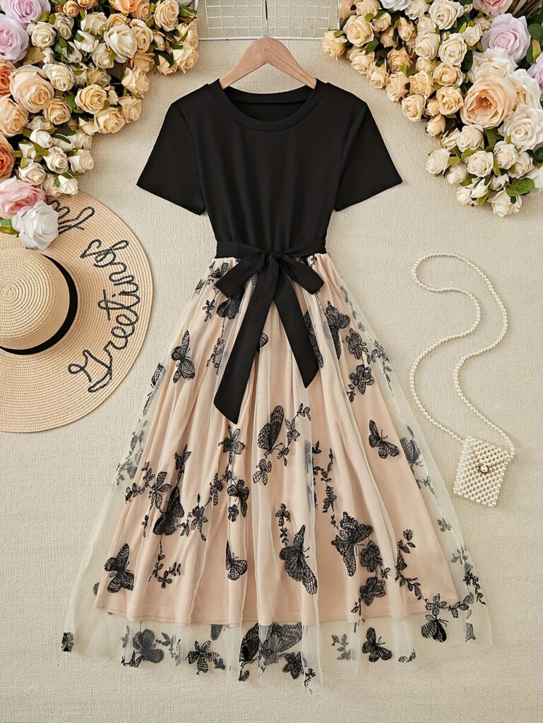 Ethereal Embroidered Fit and Flare Dress from Newness, showcasing delicate butterfly and floral embroidery. Perfect for all seasons.