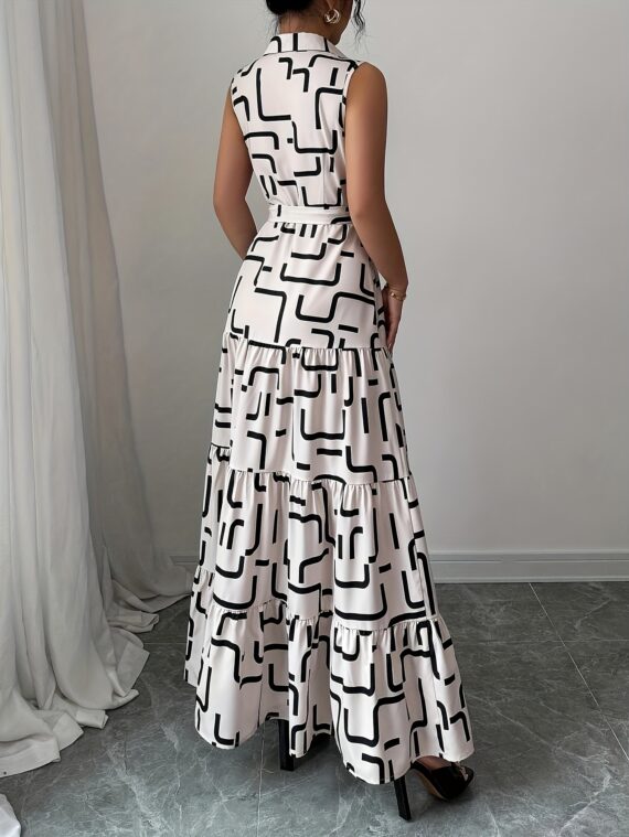 Model wearing the Newness Cairo Nights Geometric Print Dress a chic belted dress perfect for summer featuring a striking geometric print