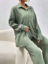 Model wearing the Newness Dubai Nights Off Shoulder Pants Set a luxurious polyester two piece outfit featuring an off shoulder top and wide leg pants perfect for evening events