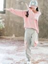 Adorable girls playful dolphin print suit in a comfortable loose fit perfect for spring and fall