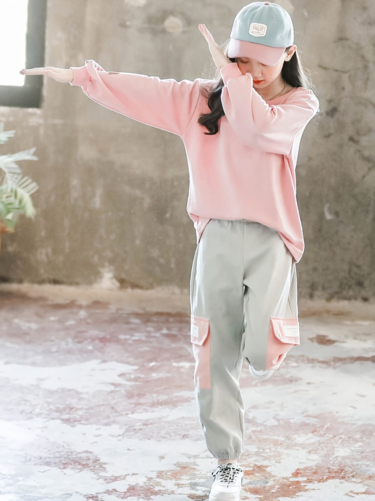 Adorable girls playful dolphin print suit in a comfortable loose fit perfect for spring and fall