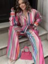 The Newness Riviera Striped Suit Set A chic spring outfit featuring a striped button up shirt and belted pants Perfect for any occasion