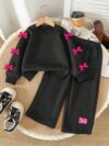 Adorable girls two piece autumn outfit cozy knit top and loose fitting pants perfect for fall adventures Dubai design
