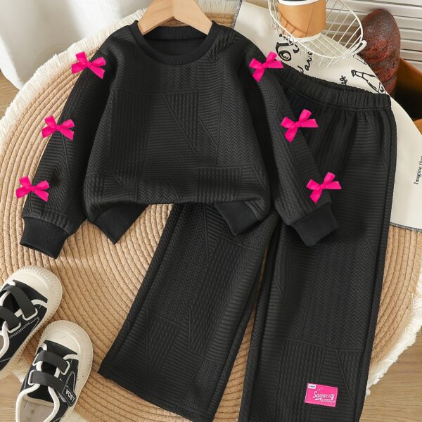 Adorable girls' two-piece autumn outfit: cozy knit top and loose-fitting pants, perfect for fall adventures. Dubai design.