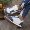 Stylish and comfortable Newness Cityscape Casual Fabric Sneakers perfect for everyday wear in any season The image shows the sneakers from an angle showcasing the fabric texture and design details