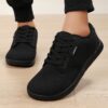 Newness Effortless Stride Wide Fit Sneakers in white showcasing the comfortable design and stylish look Perfect for all day wear