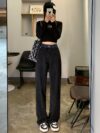 Model wearing Newness Seoul Street Style High Waisted Wide Leg Jeans showcasing the comfortable fit and chic style The jeans are a wide leg style with a high waist
