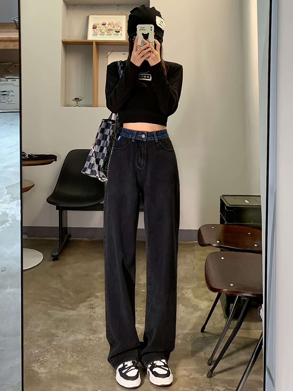 Model wearing Newness Seoul Street Style High Waisted Wide Leg Jeans showcasing the comfortable fit and chic style The jeans are a wide leg style with a high waist