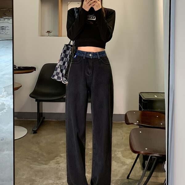 Model wearing Newness Seoul Street Style High Waisted Wide Leg Jeans showcasing the comfortable fit and chic style The jeans are a wide leg style with a high waist