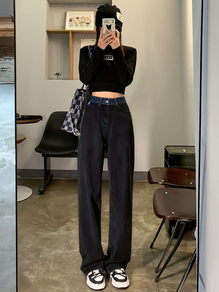 Model wearing Newness Seoul Street Style High-Waisted Wide-Leg Jeans, showcasing the comfortable fit and chic style. The jeans are a wide-leg style with a high waist.