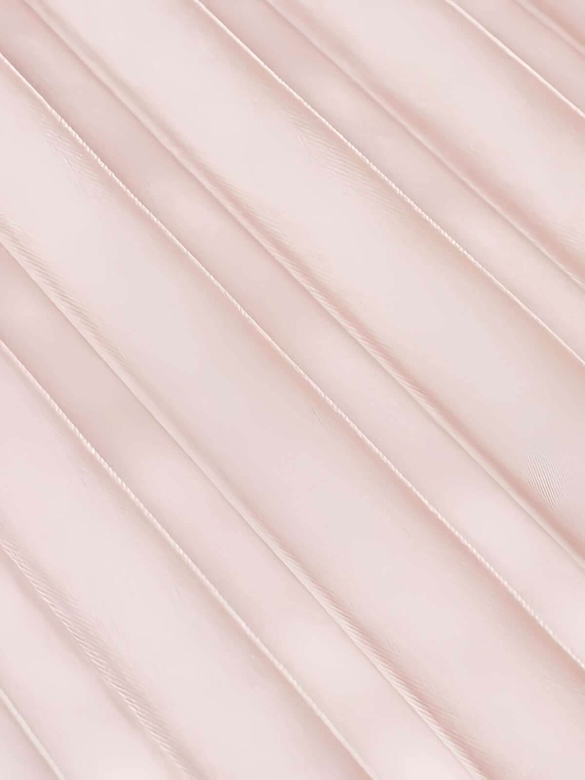 Flatlay of the Newness Bisous Rosé pink pleated midi set showcasing the skirt and top separately and together The set is a beautiful shade of pink and features delicate pleats