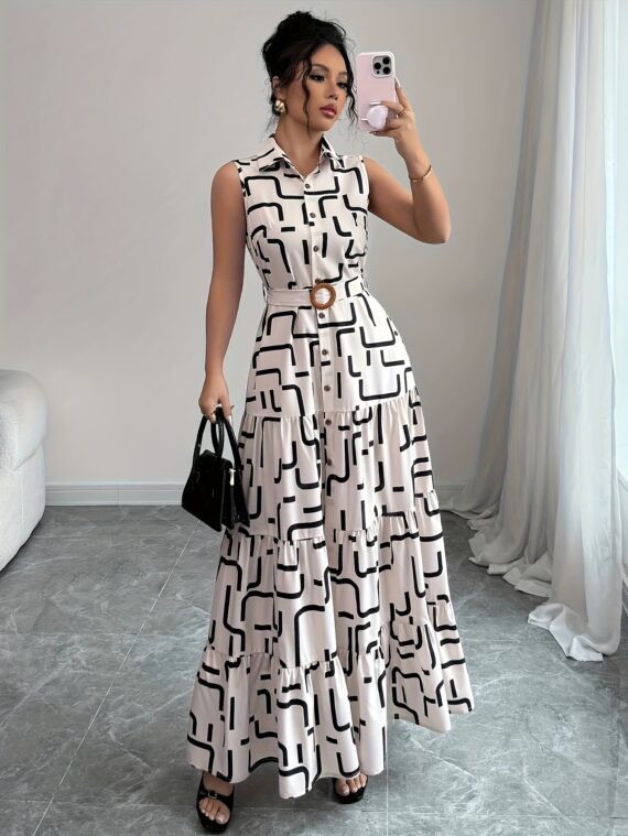Model wearing the Newness Cairo Nights Geometric Print Dress a chic belted dress perfect for summer featuring a striking geometric print