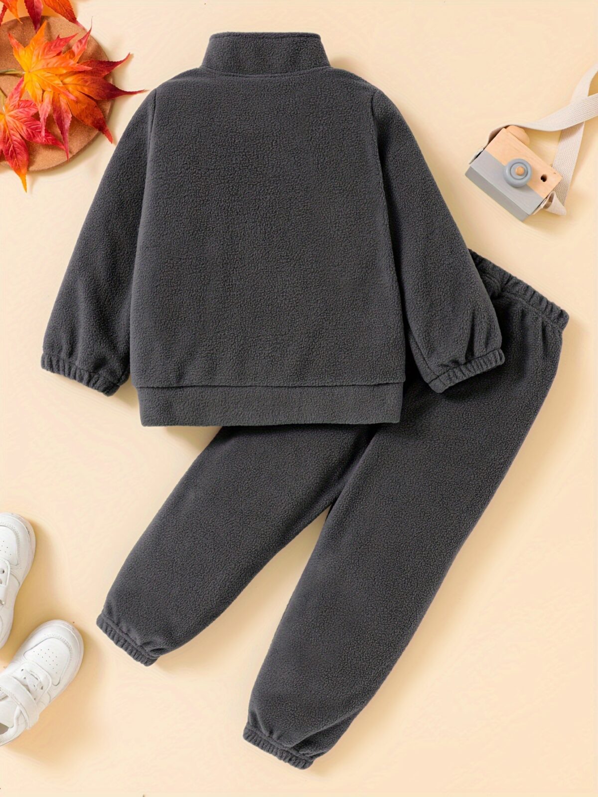 Newness Cozy Comfort Boys Winter Fleece Set A stylish and cozy two piece fleece set for boys perfect for keeping warm during winter The image shows a boy wearing the set showcasing its soft fleece fabric and trendy design