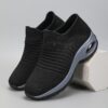 Womens black slip on sneakers with breathable knit upper comfortable wedge heel and cushioned sole
