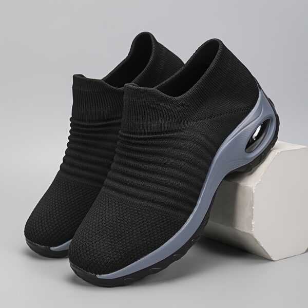 Black Womens SlipOn Knit Sneakers with Wedge Heel Newness Bangladesh Womens black slip on sneakers with breathable knit upper comfortable wedge heel and cushioned sole