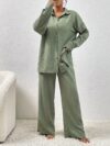 Model wearing the Newness Dubai Nights Off Shoulder Pants Set a luxurious polyester two piece outfit featuring an off shoulder top and wide leg pants perfect for evening events