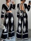 Effortlessly chic Casablanca Ethnic Print Set from Newness featuring a backless top and wide leg pants Model showcases the two piece outfit