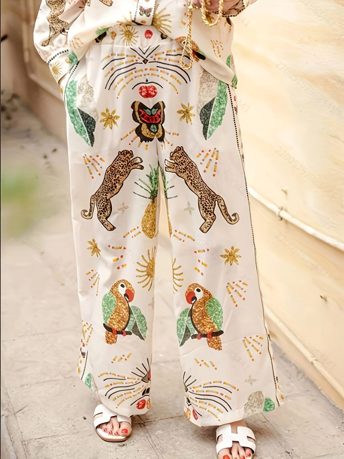 Embrace effortless chic in the Newness Escape to Paradise Tropical Print Pantsuit This vibrant pantsuit perfect for vacations and summer days features a stunning tropical print