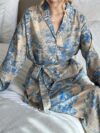 Effortlessly chic Riviera Romance floral print two piece set featuring a long sleeve shirt and wide leg pants perfect for all seasons