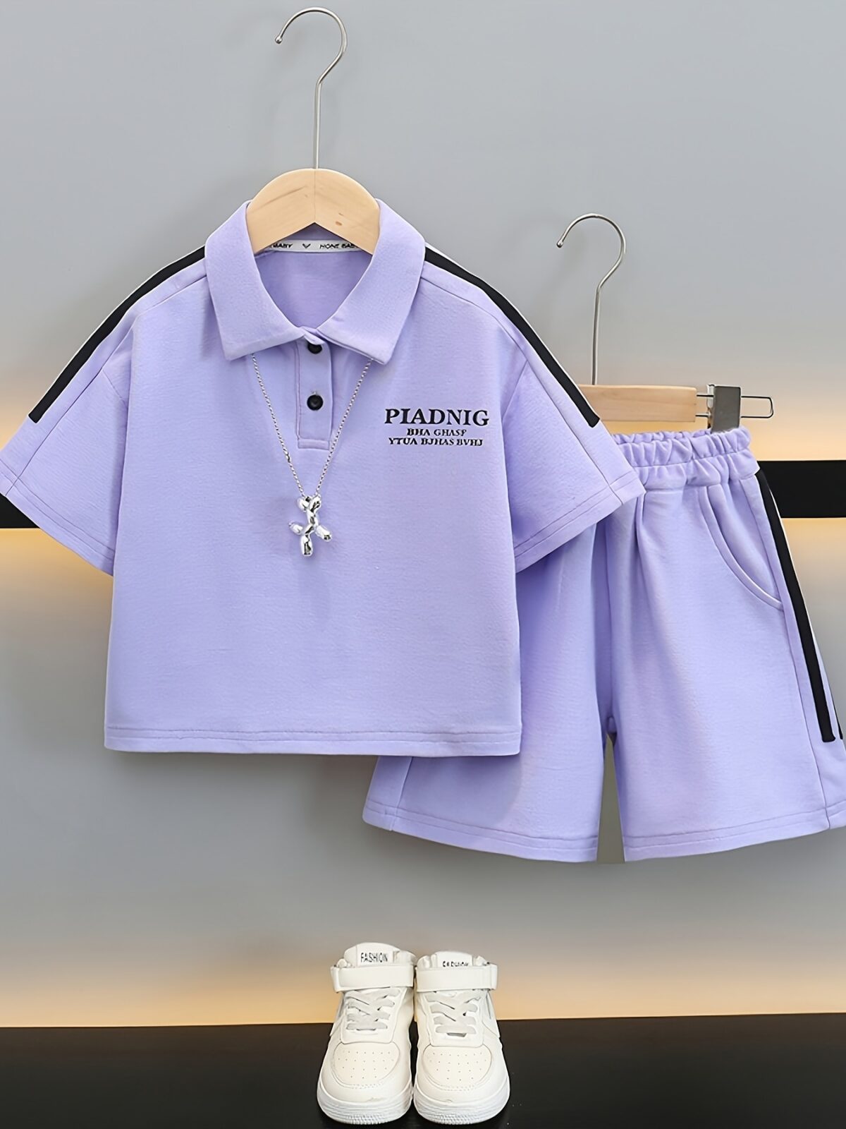 Stylish purple sports set for boys aged 12 and under Breathable polyester fabric ensures comfort and freedom of movement Perfect for summer activities