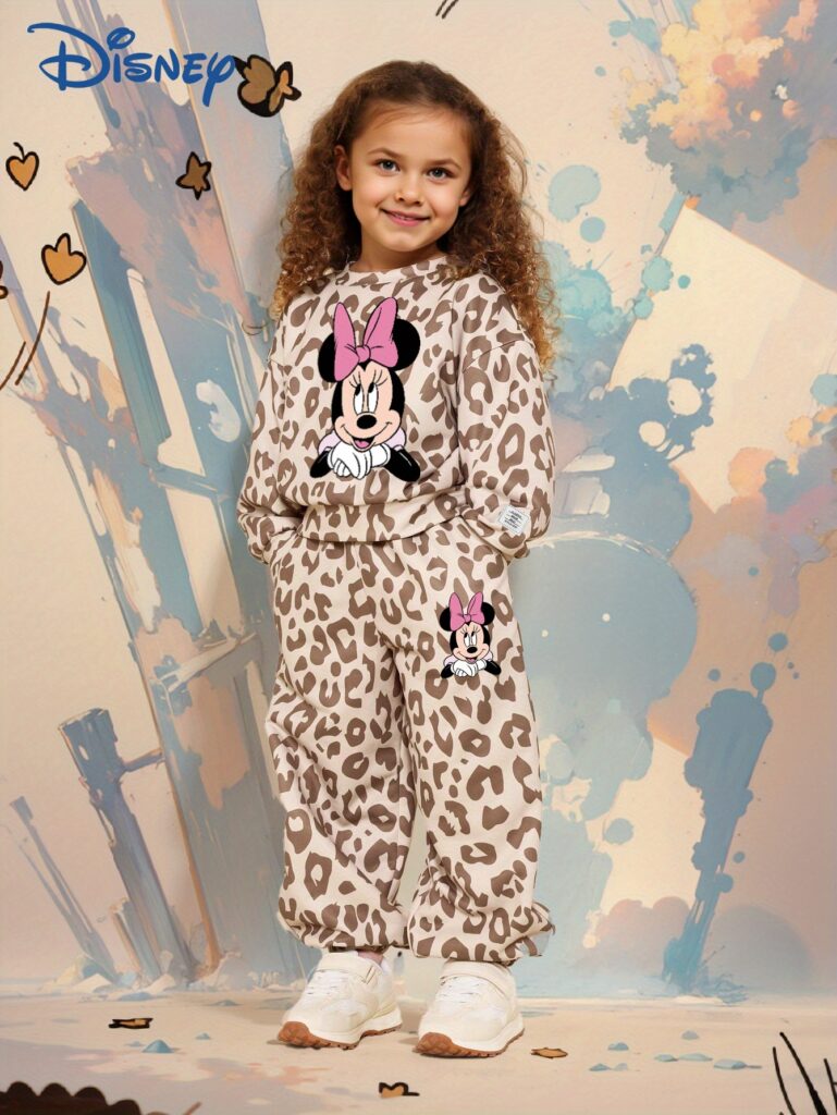 Adorable girl wearing a stylish leopard print set, perfect for play or everyday wear.