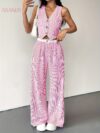 The Newness Riviera Striped Trouser Set in a flattering pose showcasing its relaxed fit and chic style Model is wearing the matching top and trousers
